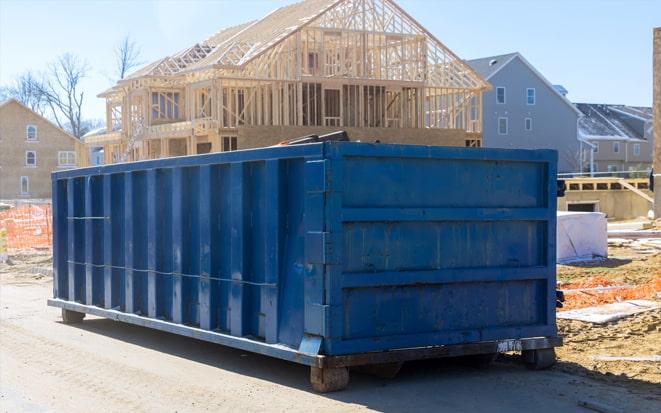 dumpster in driveway during renovation